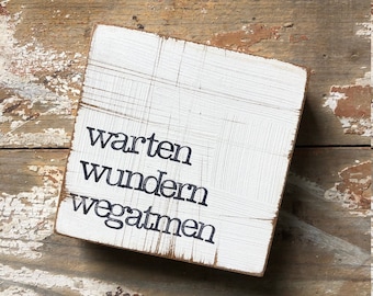 Placa de texto "espera, maravilla, respira"