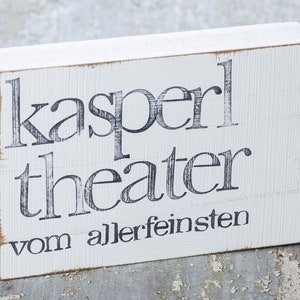 Imagem de texto na parede "Kasperltheater"