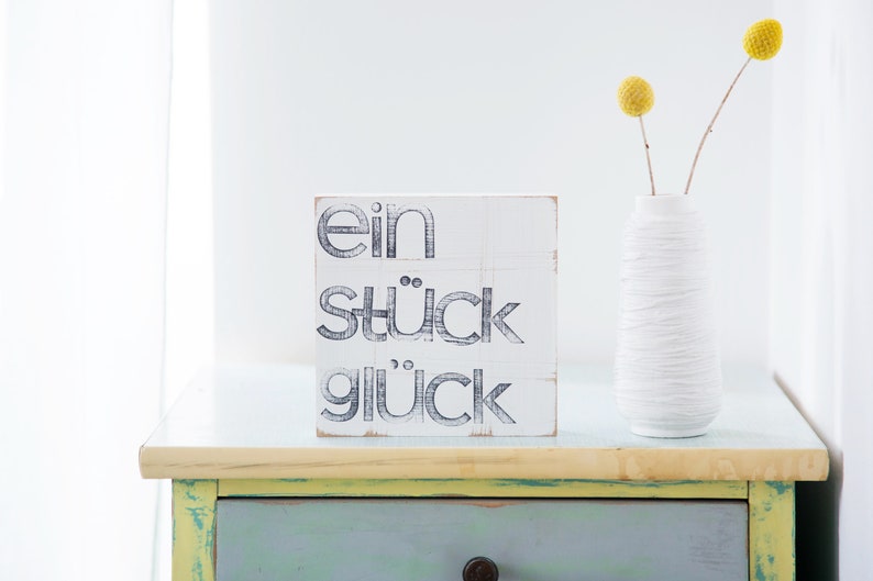 Wort Bild an der Wand ein stück Glück Bild 1