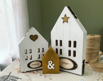 Rustic Christmas table top/shelf ornament “Merry & Bright”. Made of wooden houses with vintage metal, wood and canvas details.