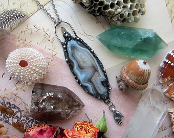 Game of Thrones inspired necklace with brown agate, smoky quartz point, and rustic hand charm. Custom length stainless steel chain.