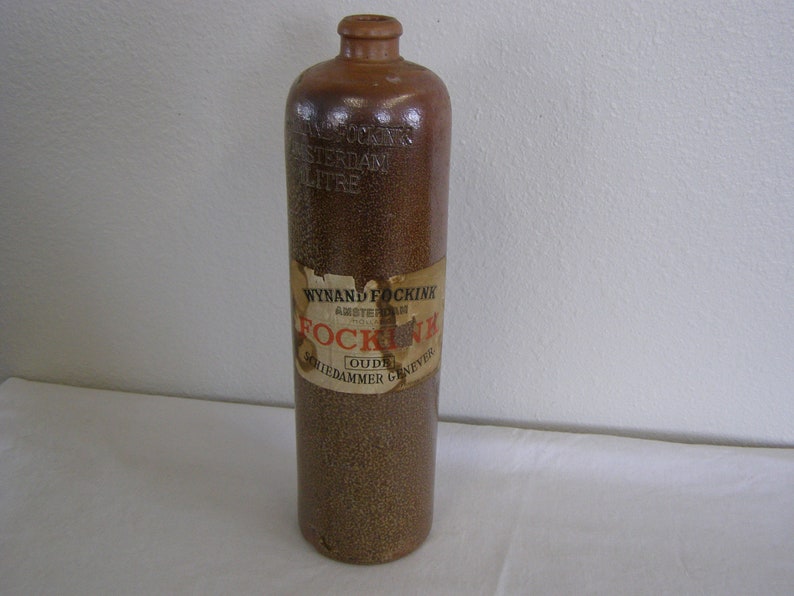 Antique Wynand Fockink Amsterdam Stoneware Gin Bottle. 1 Liter with partial label. image 1