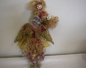 Undead scary doll. OOAK, recreated and repainted by me. Dressed in yellow and green