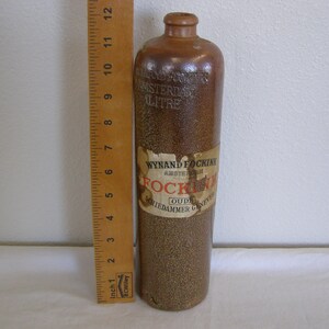 Antique Wynand Fockink Amsterdam Stoneware Gin Bottle. 1 Liter with partial label. image 7