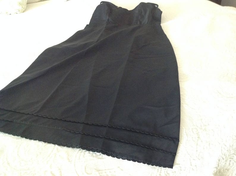 circa 1960 Vintage black full slip
