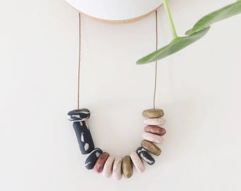 Olivia Black - Handmade polymer clay necklace, 14 bead, adjustable brown cotton cord
