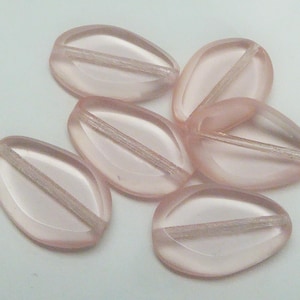 May include: A collection of six translucent, teardrop-shaped beads in a soft pink hue. Each bead features a central, straight channel for stringing. The beads are smooth and have a slightly frosted appearance, ideal for jewelry making.