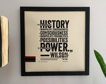 May include: Black and white framed print with a quote by Dr. Amos Wilson, "History is to manipulate consciousness; to consciousness is to manipulate possibilities; possibilities is to manipulate power."