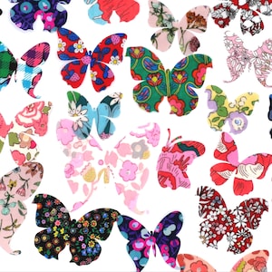 May include: A selection of patterned butterfly shapes in a range of colours, including pink, red, blue, green, and black, set against a white backdrop. The butterflies feature floral and other designs, showcasing a variety of fabric patterns.