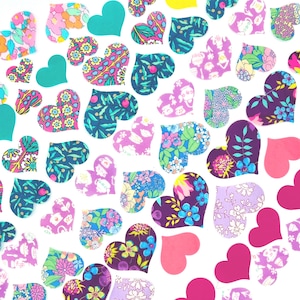 May include: A collection of heart-shaped cutouts in various colors and patterns. Some hearts are solid teal, pink, and yellow. Others feature floral and botanical designs in shades of blue, purple, and pink, creating a vibrant and cheerful aesthetic.