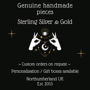Eleven Feathers Jewellery. Genuine handmade pieces. Sterling Silver & Gold. Custom orders on request. Personalisation & gift boxes available. Northumberland UK. Est 2013. Black background, illustrated hands holding jewellery, moons and stars.