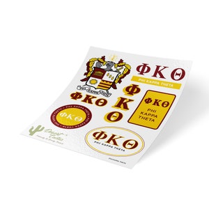 May include: A set of Phi Kappa Theta fraternity stickers featuring a crest, letters, and the words "Phi Kappa Theta". The stickers are on a white background.