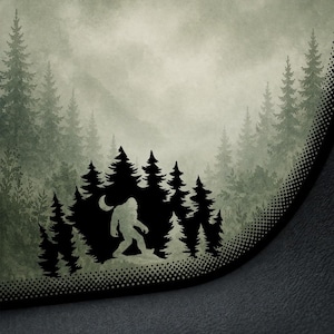 May include: A forest-themed design featuring a silhouette of Bigfoot walking in front of a forest of pine trees. The background has a misty, faded look, with a dotted border.