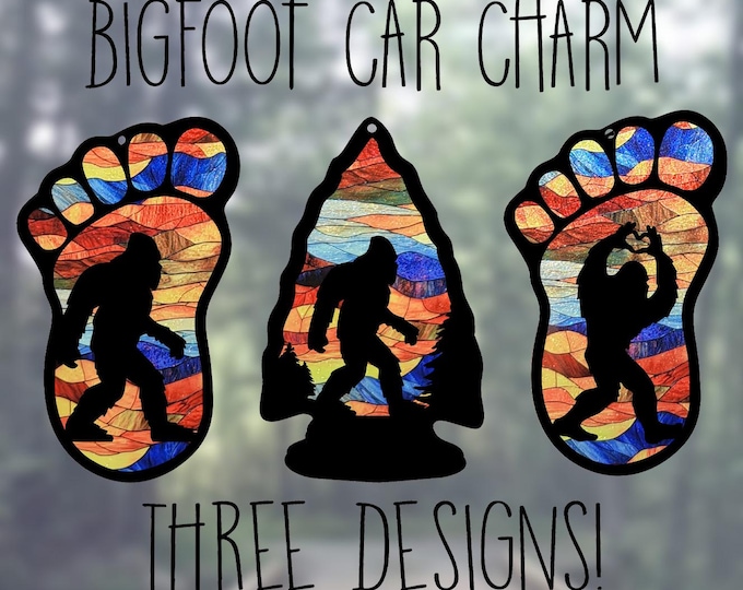 Featured listing image: Car Rearview Mirror Suncatcher Charm | Bigfoot Heart Hands | Bigfoot in Arrowhead | Bigfoot Print | Abstract Rustic Mountains Stained Glass