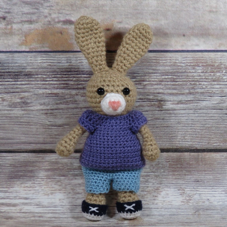 crochet amigurumi rabbit wearing shirt shorts and sneakers