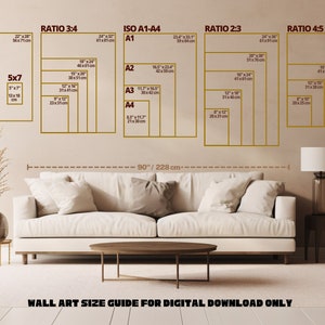 May include: A wall art size guide for digital downloads only. The guide shows different sizes of prints in inches and centimeters, including 11x14, 5x7, 3:4 ratio, A1-A4, 2:3 ratio, and 4:5 ratio. The guide is displayed on a wall with a white couch and a brown coffee table in front of it.