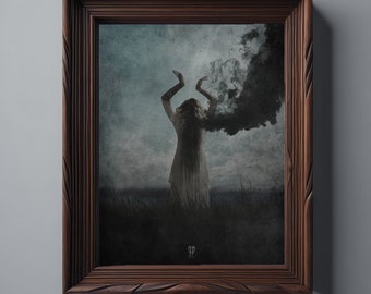 May include: A framed artwork featuring a woman with arms raised, dark smoke emanating from her head. The image is set in a field with a dark sky. The frame is made of dark brown wood with carved details.