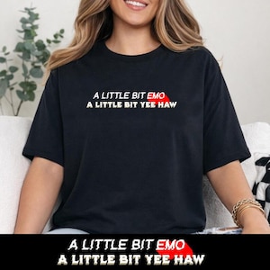 May include: Black t-shirt with the text "A LITTLE BIT EMO" in white, with the word "EMO" in red, and "A LITTLE BIT YEE HAW" in white. The shirt is a casual style.