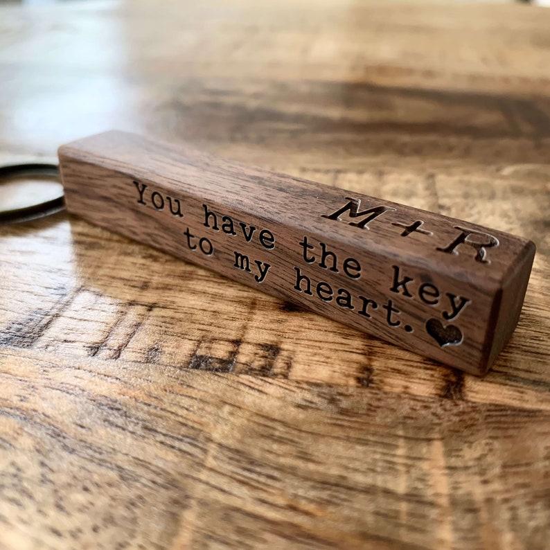 May include: A wooden keychain with the text "You have the key to my heart." and the initials "M+R" engraved on it.