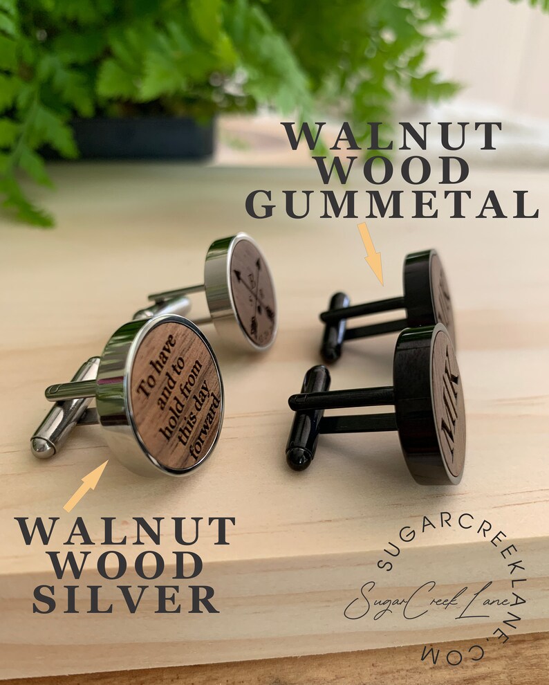 May include: Two pairs of cufflinks with walnut wood inlays. One pair has a silver finish and the other has a gunmetal finish. The silver pair has the text "To have and to hold from this day forward" engraved on the wood inlay. The gunmetal pair has the text "Milk" engraved on the wood inlay.