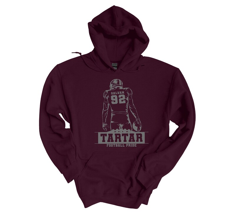 May include: Burgundy hooded sweatshirt with a gray graphic of a football player with the number 92 and the text "GALVAN" on the back. The text "TARTAR FOOTBALL PRIDE" is printed below the player.