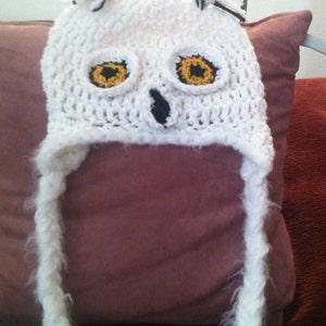 Beautiful white snowy owl crochet hat with earflaps and braids made to order for any size