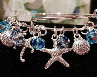 Pulsera de plata con dije de estrella de mar: joyería de playa con conchas marinas