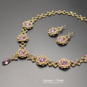 May include: A delicate pink and green beaded necklace and matching earrings with a floral design. The necklace features a teardrop pendant.