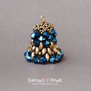 May include: A handcrafted bell-shaped pendant composed of metallic gold and deep blue faceted beads. The top section is a cluster of small gold beads, transitioning to a body of blue and gold beads. The pendant has a small loop for hanging.