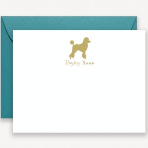 May include: A white card with a gold silhouette of a standard poodle and the text "Hayley Brown" in gold script.