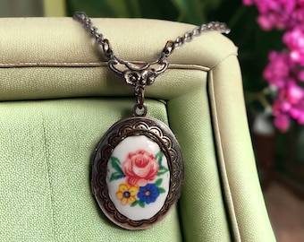 VNTG Birth flower locket necklace Small oval locket 2 picture locket Antique silver floral necklace Mothers day gift Sentimental Memory gift