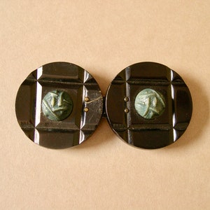 Art Deco women&#39;s belt buckle, 1920s-30s, bakelite or celluloid, two piece, black and dark jade green, carved with cast cabochon, metal hook.