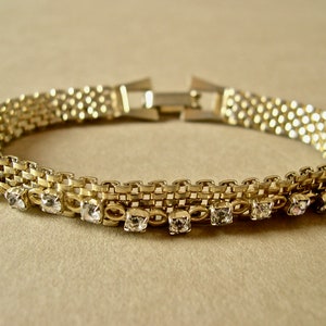 Vintage rhinestone bracelet 1950&#39;s-60&#39;s, gold toned woven link band with clear facetted stones on gold toned chain, delicate scale.