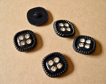 Vintage dress buttons, 1940's-early 1950's, set of five, four clear rhinestones set in black plastic, shank style, 5/8" diameter.