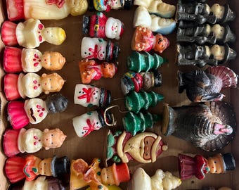 38 vintage girly candles, mostly Christmas and Thanksgiving themed. They are unburned and indecent, but not perfect condition.