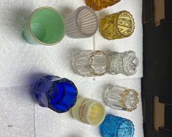 Beautiful collection of 12 vintage pressed glass open salt cellars (also called salt dips). Most feature lovely scalloped or decorative rims