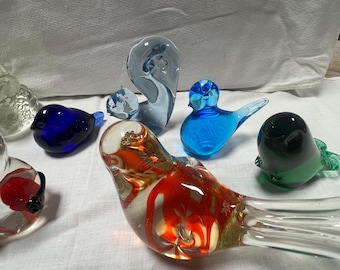 A lot of seven beautiful glass animal paperweights including birds, bear a squirrel a duck