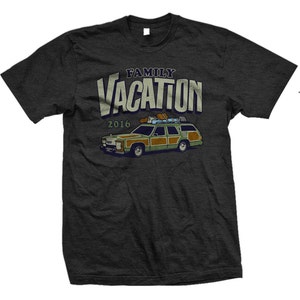 May include: A dark gray t-shirt with a vintage-style graphic of a station wagon with the text "FAMILY VACATION 2016" above it.