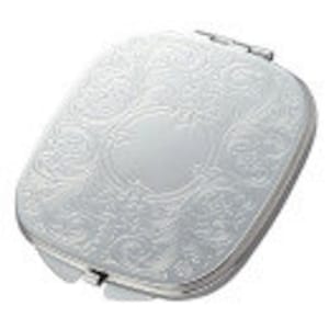 May include: A silver compact mirror with an ornate, engraved design. The mirror has a hinged lid and a small, oval-shaped mirror inside.