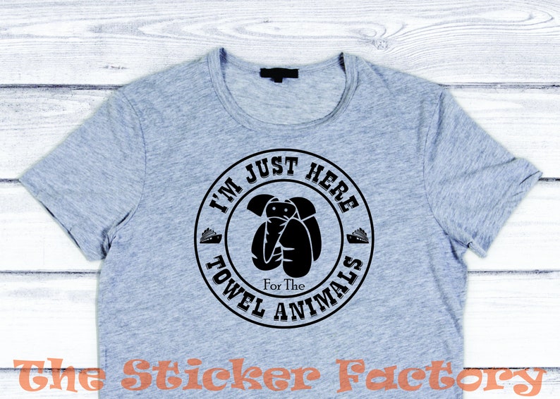 May include: A gray t-shirt with a black circle graphic that says "I'm Just Here For The Towel Animals".