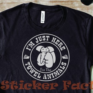 May include: Black t-shirt with a white circle graphic that says "I'm Just Here For The Towel Animals".