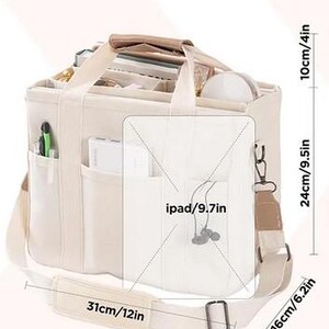 May include: Beige canvas tote bag with multiple compartments and a shoulder strap. The bag measures 12 inches wide, 9.5 inches high, and 6.2 inches deep. It has a top handle and a front pocket designed to hold an iPad.