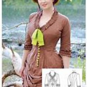 May include: A brown Victorian-style dress with a ruffled neckline and sleeves, featuring a green bow and decorative buttons. The dress has a fitted bodice and a gathered skirt. A matching hat with a green accent sits atop the model's head. The image includes a sketch of the dress.