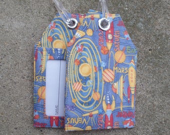Solar Planets Luggage Solar System Fabric Luggage Tags with Rocket Ships Blue and Gold Bag Tags to mark your Gear.