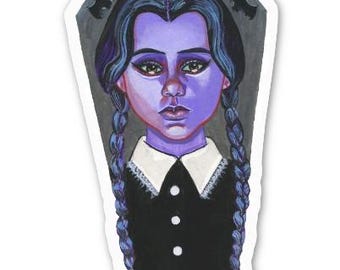 May include: A sticker featuring a cartoon girl with blue hair and a black dress. The girl has a sad expression and the text "I hate everything" is written above her head.