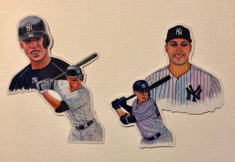 May include: Three watercolor illustrations of baseball players wearing New York Yankees uniforms. The first illustration shows a player in a blue jersey with a white 'NY' logo, the second shows a player in a pinstripe jersey with a white 'NY' logo, and the third shows a player in a pinstripe jersey with a white 'NY' logo.