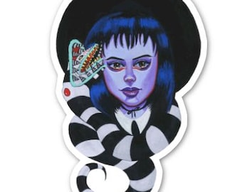 May include: A sticker featuring a cartoon illustration of a girl with black hair and a black hat. She is wearing a black and white striped dress and has a large, toothy, green creature behind her head.