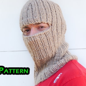 May include: A beige knitted balaclava with eye holes. The balaclava is worn by a person with a red shirt. The word "PATTERN" is written in green letters on a black background.