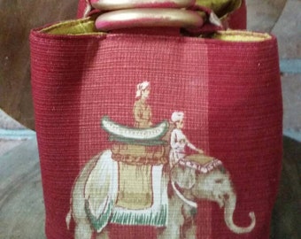 A Trio Bag worthy of a Maharani; Indian elephants marching around and below on soft red slubbed cotton with a gold red silk lining. Exotic!