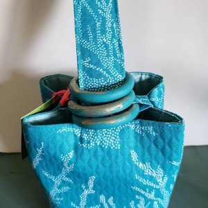 Bright turquoise and white coral diamond stitched 100% cotton designer fabric creates a lovely Trio Bag to carry daily...and nightly.